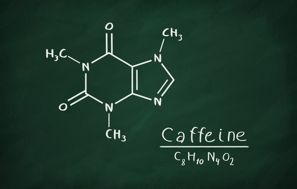 Kemisk formel af koffein på en tavle